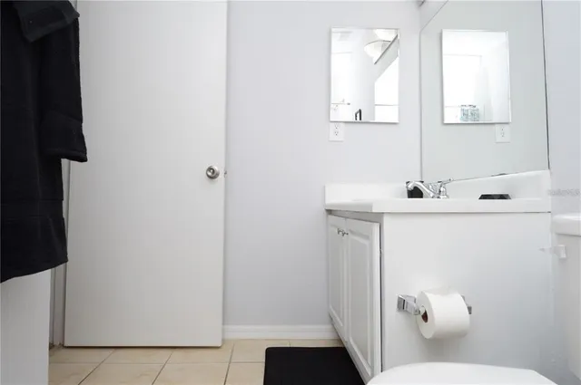 a view of a lake with a floor to ceiling window next to a lake