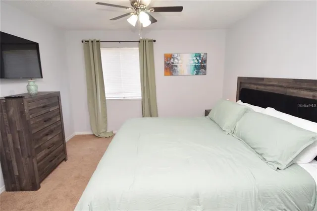 a view of a lake with houses in the background