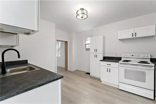 a kitchen with a stove and a sink