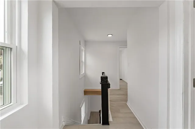 a view of hallway with stairs