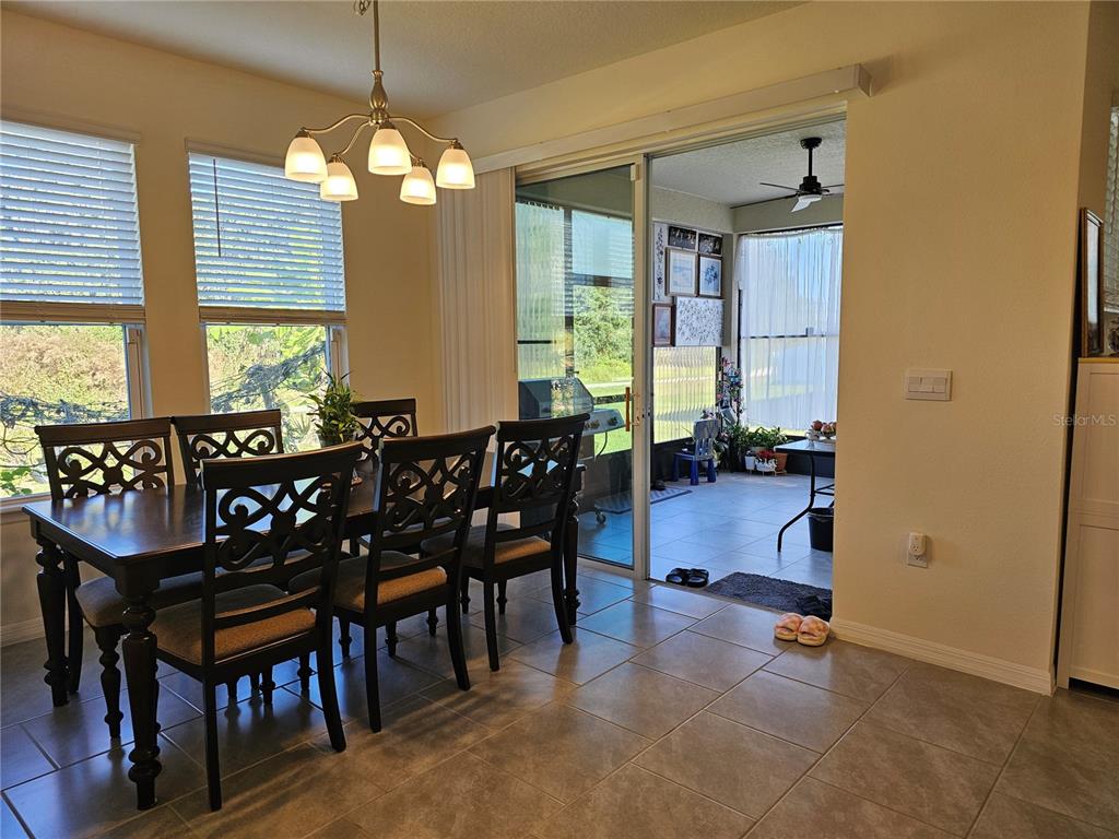 2045 Rankin Street Kissimmee, FL 34744 - Photo 12 of 38 a view of a dining room with furniture window and wooden floor