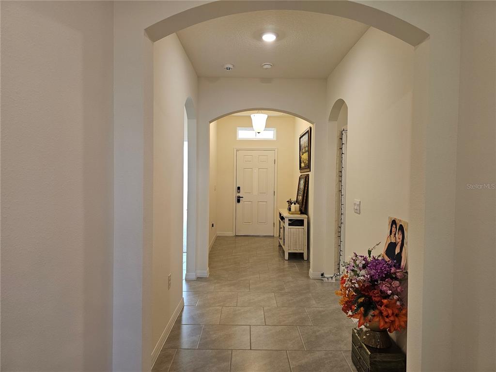 2045 Rankin Street Kissimmee, FL 34744 - Photo 14 of 38 a view of a hallway with bathroom and mirror