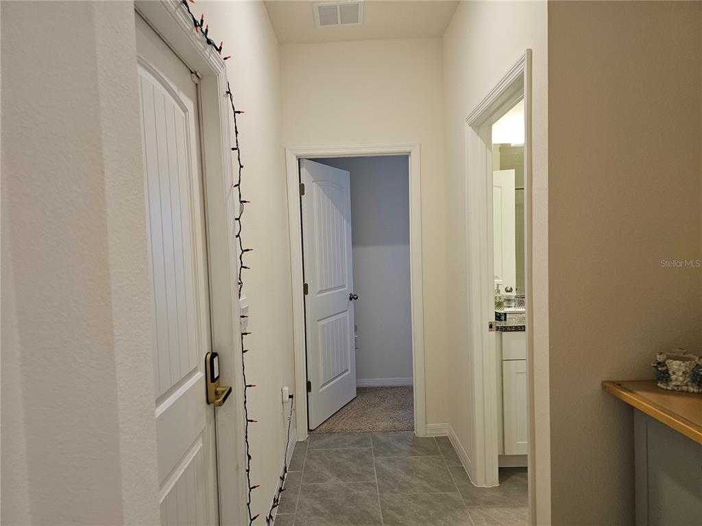 2045 Rankin Street Kissimmee, FL 34744 - Photo 18 of 38 a view of a bathroom from a hallway