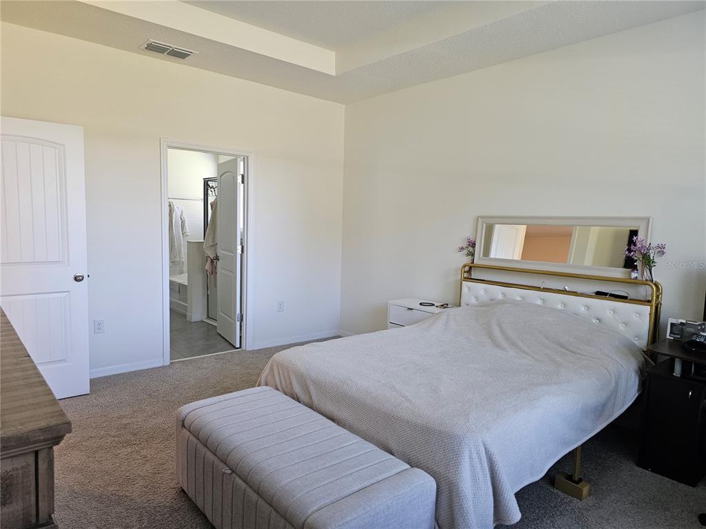 2045 Rankin Street Kissimmee, FL 34744 - Photo 24 of 38 a bedroom with a bed and a table