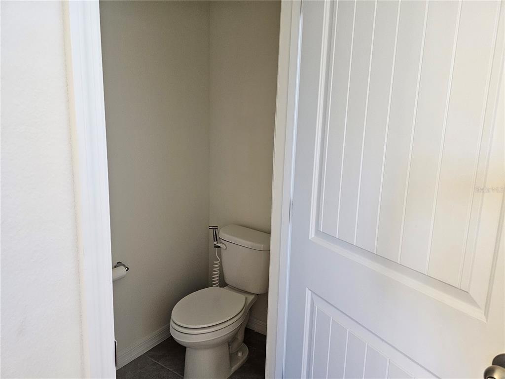 2045 Rankin Street Kissimmee, FL 34744 - Photo 26 of 38 a white toilet sitting next to a shower