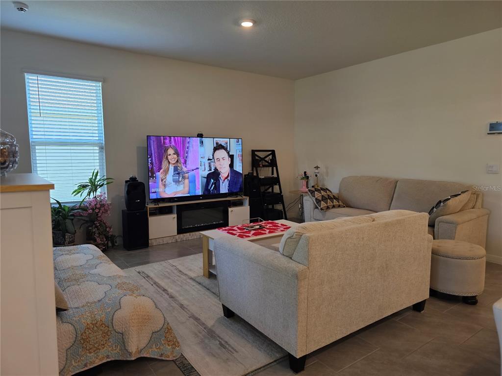 2045 Rankin Street Kissimmee, FL 34744 - Photo 3 of 38 a living room with furniture and a flat screen tv