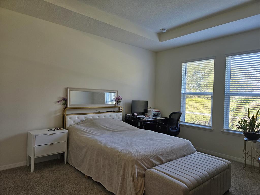 2045 Rankin Street Kissimmee, FL 34744 - Photo 10 of 38 a bedroom with a bed and a window