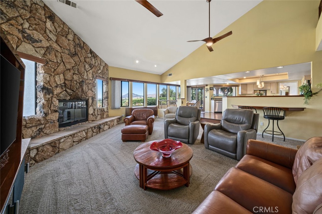 225 Broken Arrow Road Nipomo, CA 93444 - Photo 16 of 75 a living room with furniture and a fireplace