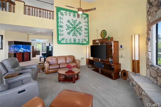 a living room with furniture potted plant and a chandelier