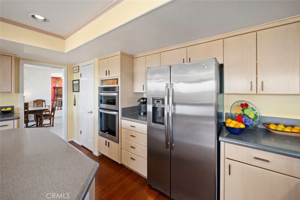 225 Broken Arrow Road Nipomo, CA 93444 - Photo 21 of 75 a kitchen with stainless steel appliances a refrigerator sink and cabinets
