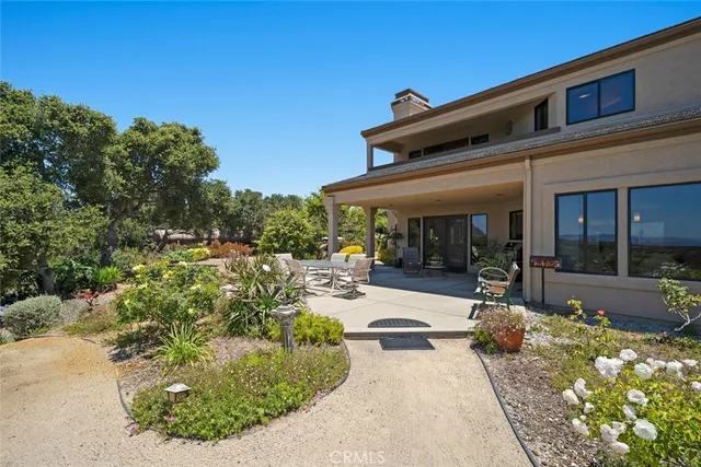 a spacious bedroom with a bed and a large window