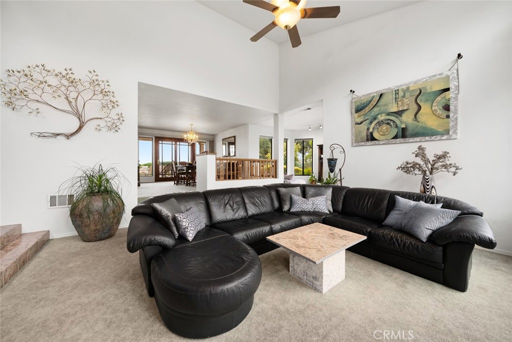 225 Broken Arrow Road Nipomo, CA 93444 - Photo 32 of 75 a living room with furniture and a potted plant