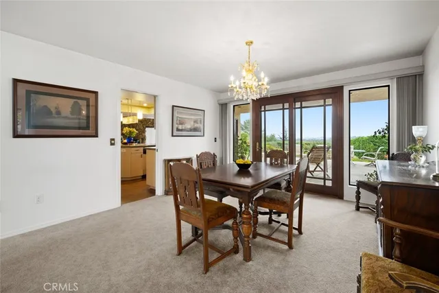 a living room with furniture a window and a flat screen tv