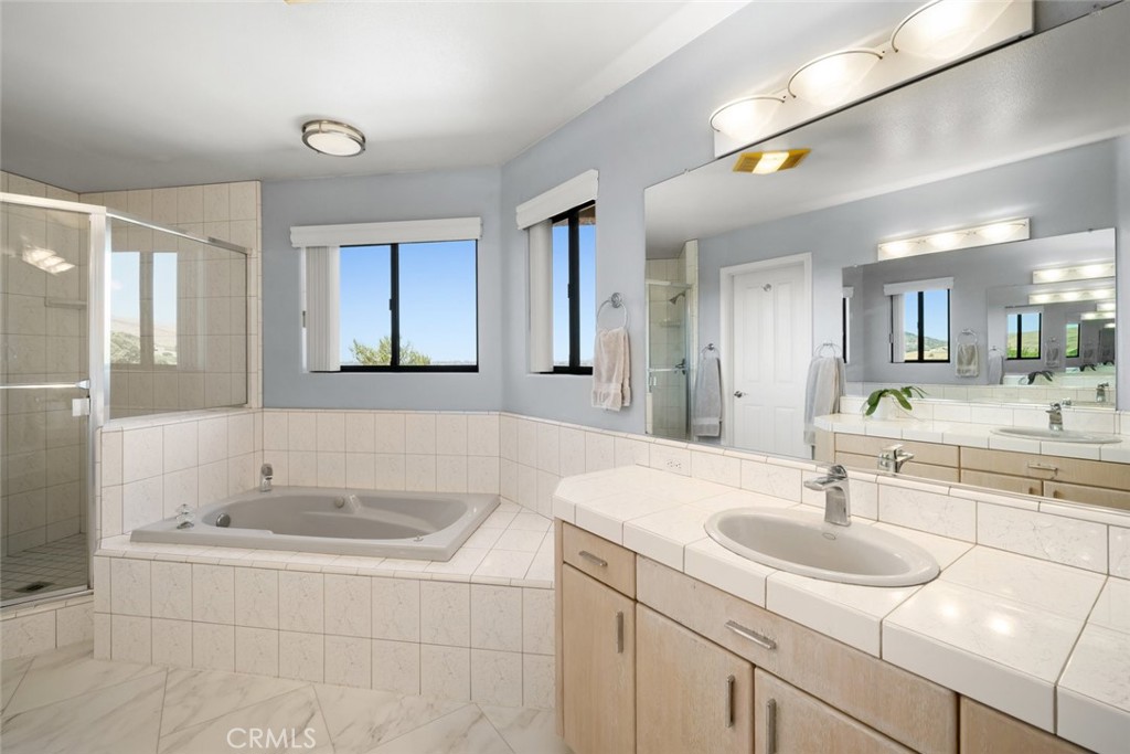 225 Broken Arrow Road Nipomo, CA 93444 - Photo 39 of 75 a bathroom with a sink and a bathtub