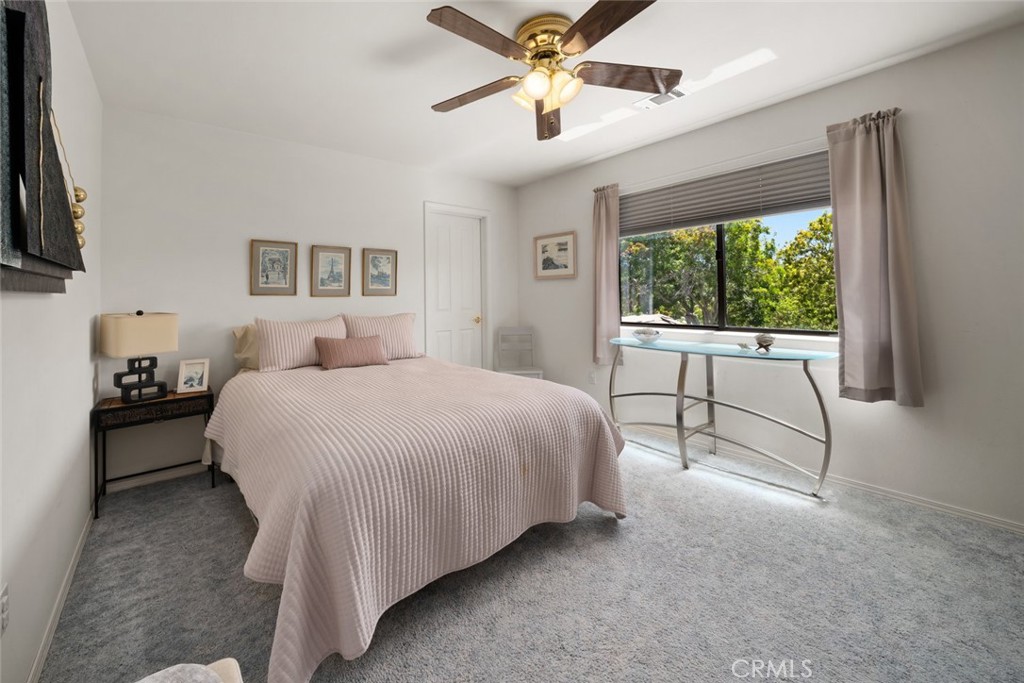 225 Broken Arrow Road Nipomo, CA 93444 - Photo 41 of 75 a spacious bedroom with a bed and a large window