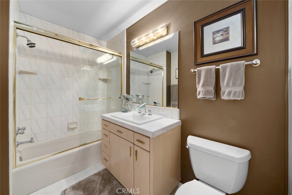 225 Broken Arrow Road Nipomo, CA 93444 - Photo 44 of 75 a bathroom with a toilet sink and a bathtub