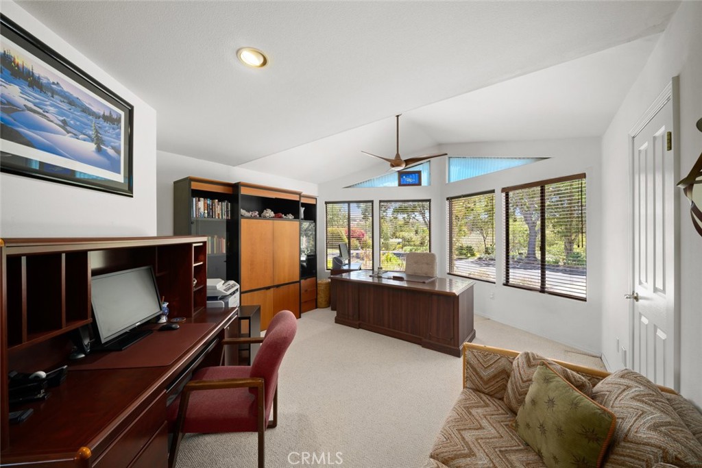 225 Broken Arrow Road Nipomo, CA 93444 - Photo 49 of 75 a living room with furniture a window and a flat screen tv