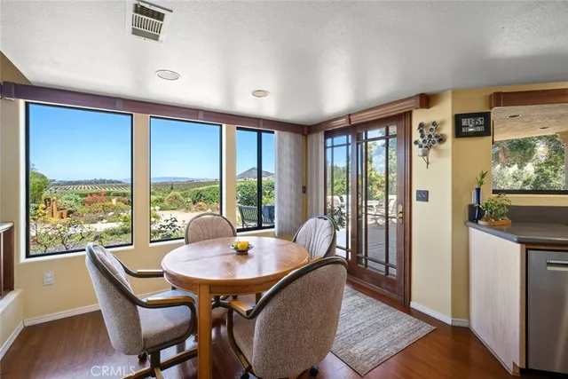 a view of a dining room with furniture window and outside view