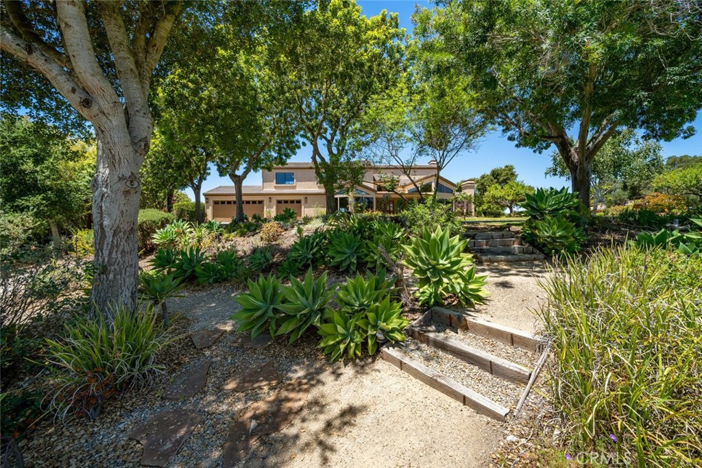 225 Broken Arrow Road Nipomo, CA 93444 - Photo 62 of 75 a front view of a house with a yard