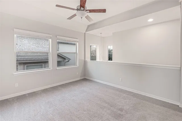 a kitchen with appliances a sink and cabinets