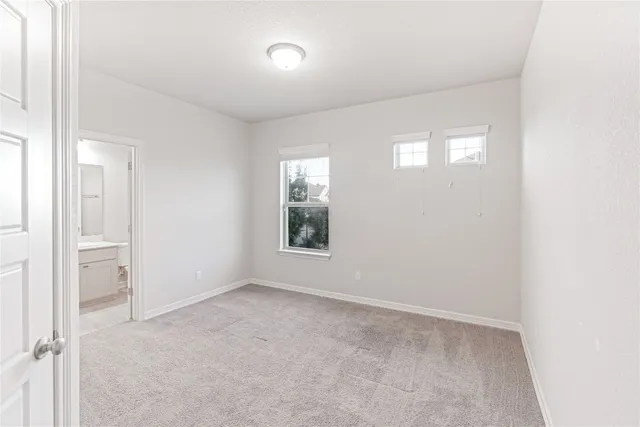 a bathroom with a shower and a sink