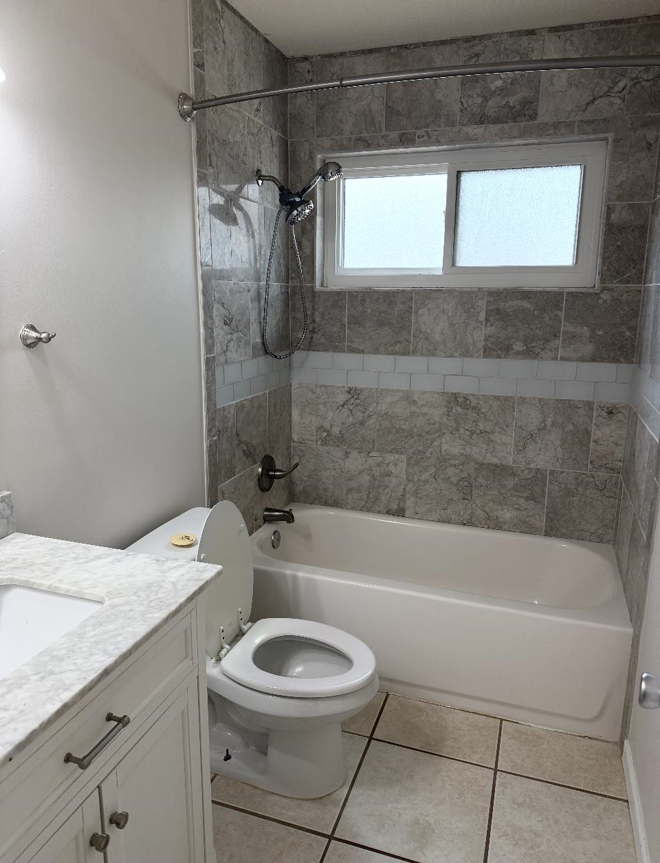928 Poplar Leaf Road Collierville, TN 38017 - Photo 5 of 8 Bathroom with vanity, bathtub / shower combination, and light tile patterned flooring