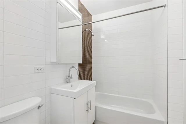 a bathroom with a sink a mirror and a shower