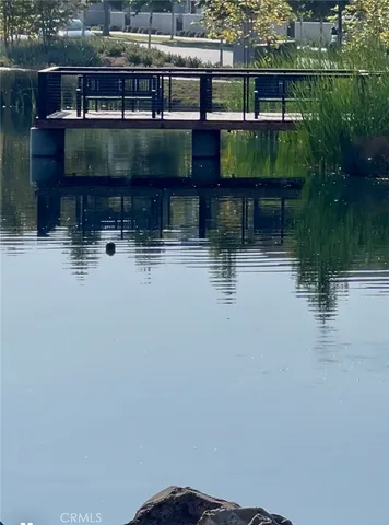 a small pool with a table and chairs