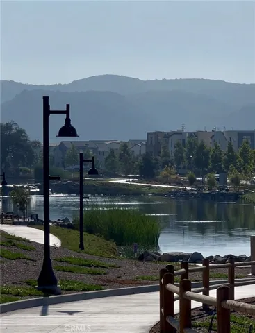 a view of a lake in front of residential houses