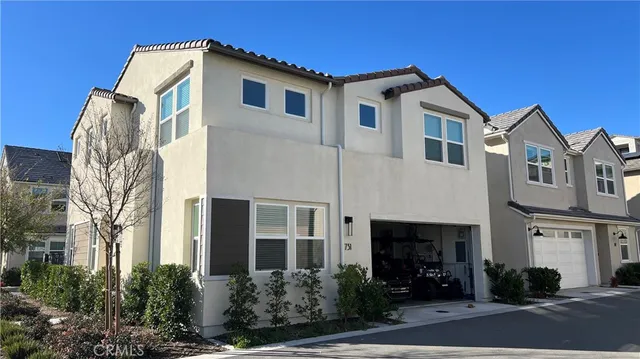 a front view of a house with yard