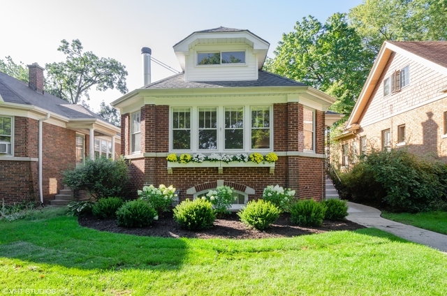3016 Thayer Street Evanston, IL 60201 - Photo 1 of 20 a front view of a house with garden