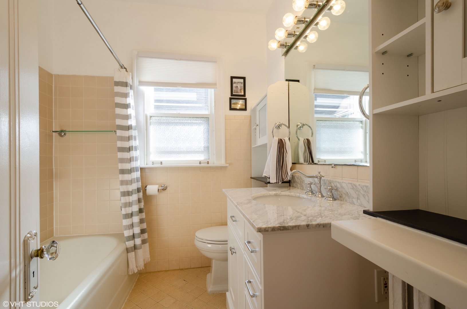 3016 Thayer Street Evanston, IL 60201 - Photo 11 of 20 a bathroom with a granite countertop sink toilet and shower