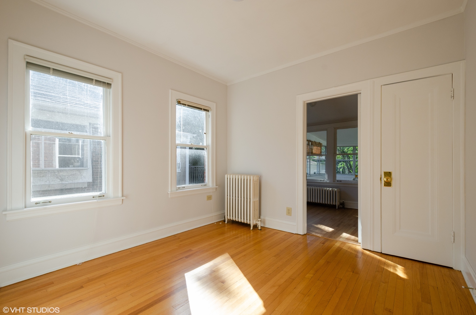 3016 Thayer Street Evanston, IL 60201 - Photo 9 of 20 a view of an empty room with a window and wooden floor