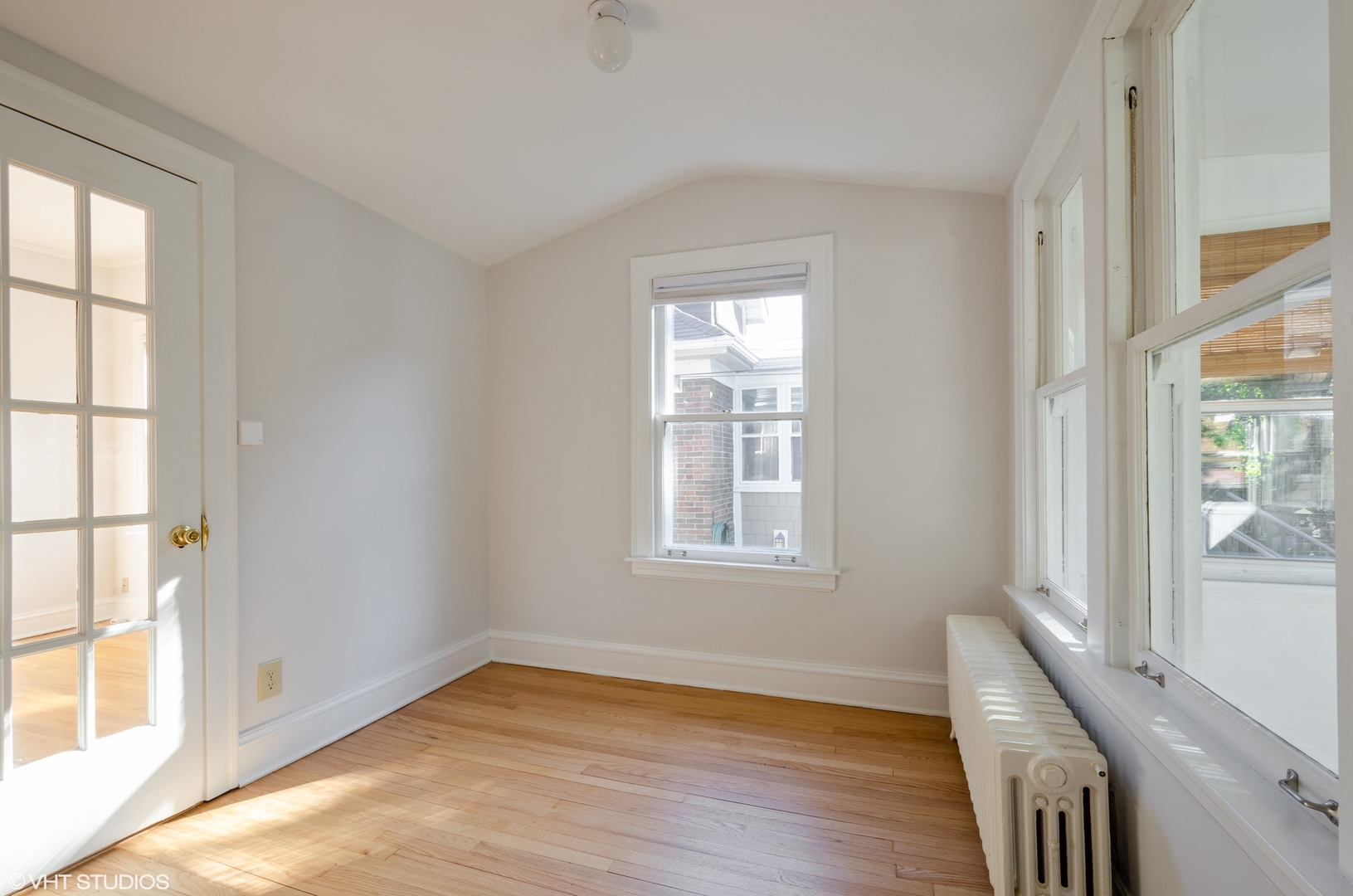 3016 Thayer Street Evanston, IL 60201 - Photo 10 of 20 an empty room with wooden floor and windows