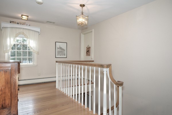 36 Packard Road Stow, MA 01775 - Photo 16 of 30 a view of a hallway with windows