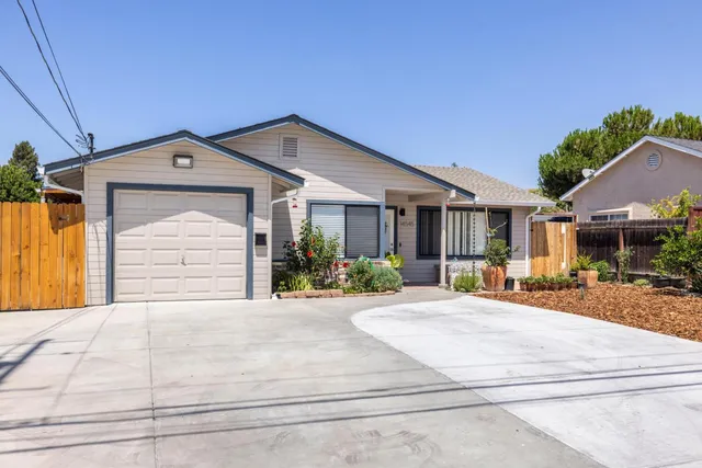 a front view of a house with basket ball court and outdoor seating