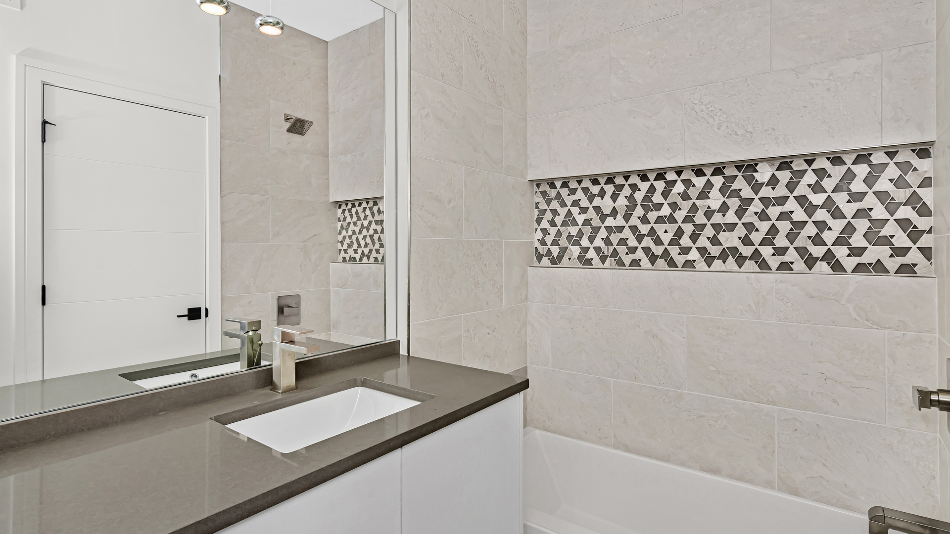 334 East Pershing Road Chicago, IL 60653 - Photo 20 of 42 a bathroom with a bathtub and a shower