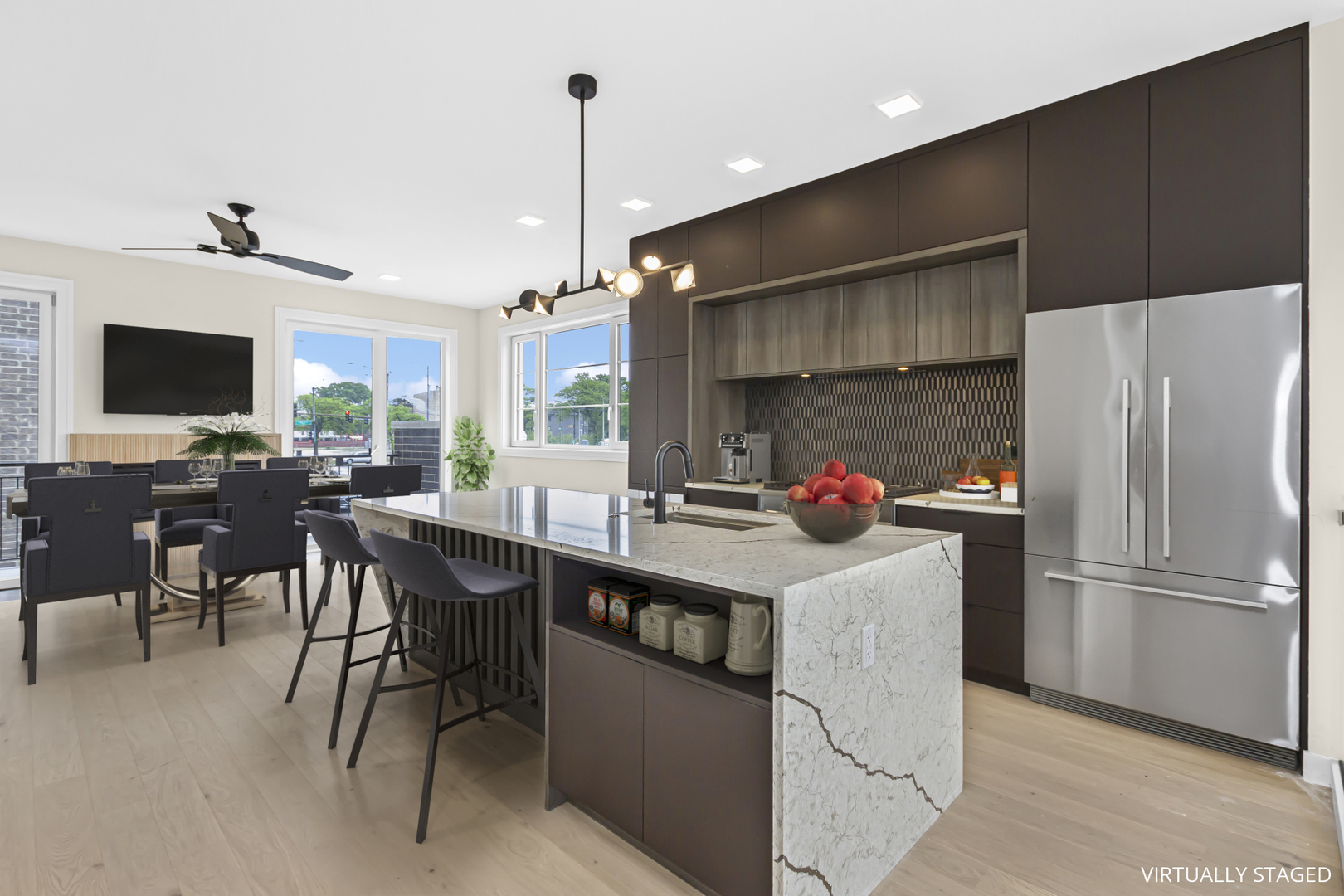 334 East Pershing Road Chicago, IL 60653 - Photo 6 of 42 a kitchen with stainless steel appliances a stove a refrigerator a sink a dining table and chairs