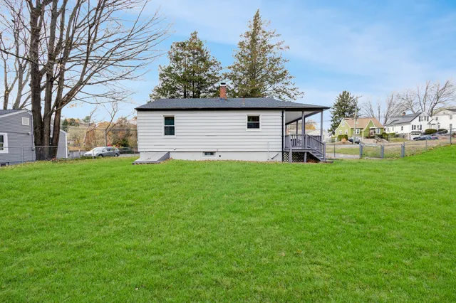 a house view with a sitting space and garden