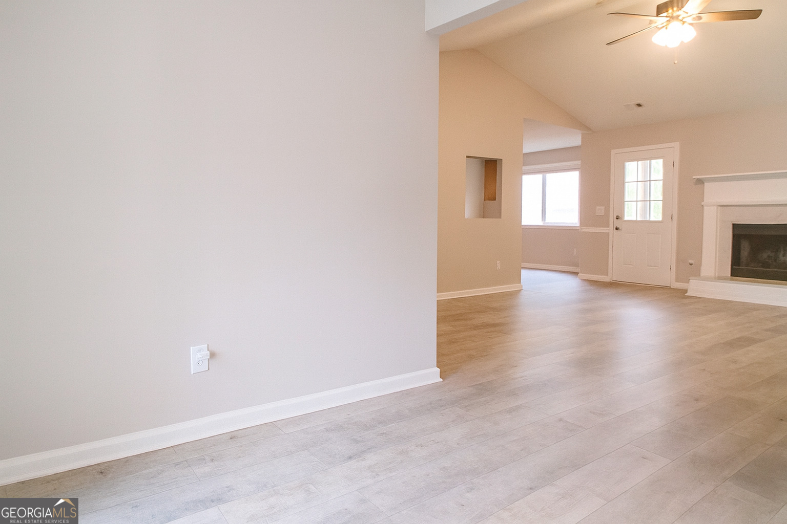 8596 Guthrie Drive Riverdale, GA 30274 - Photo 2 of 14 a view of empty room with wooden floor and fan