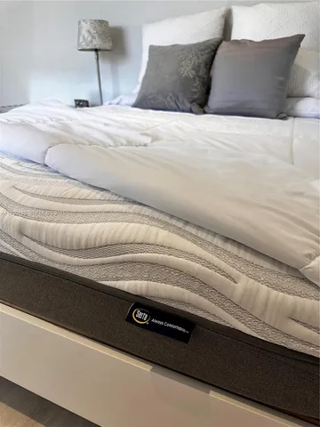 a bathroom with a bathtub and a table