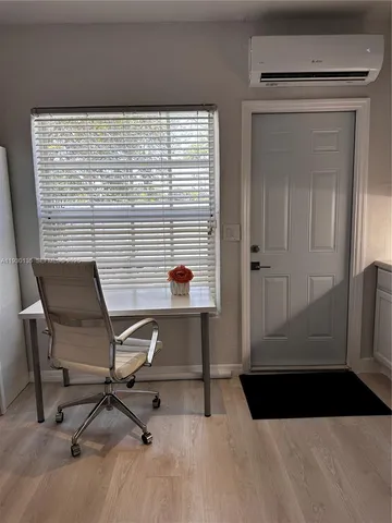 a view of a workspace with furniture