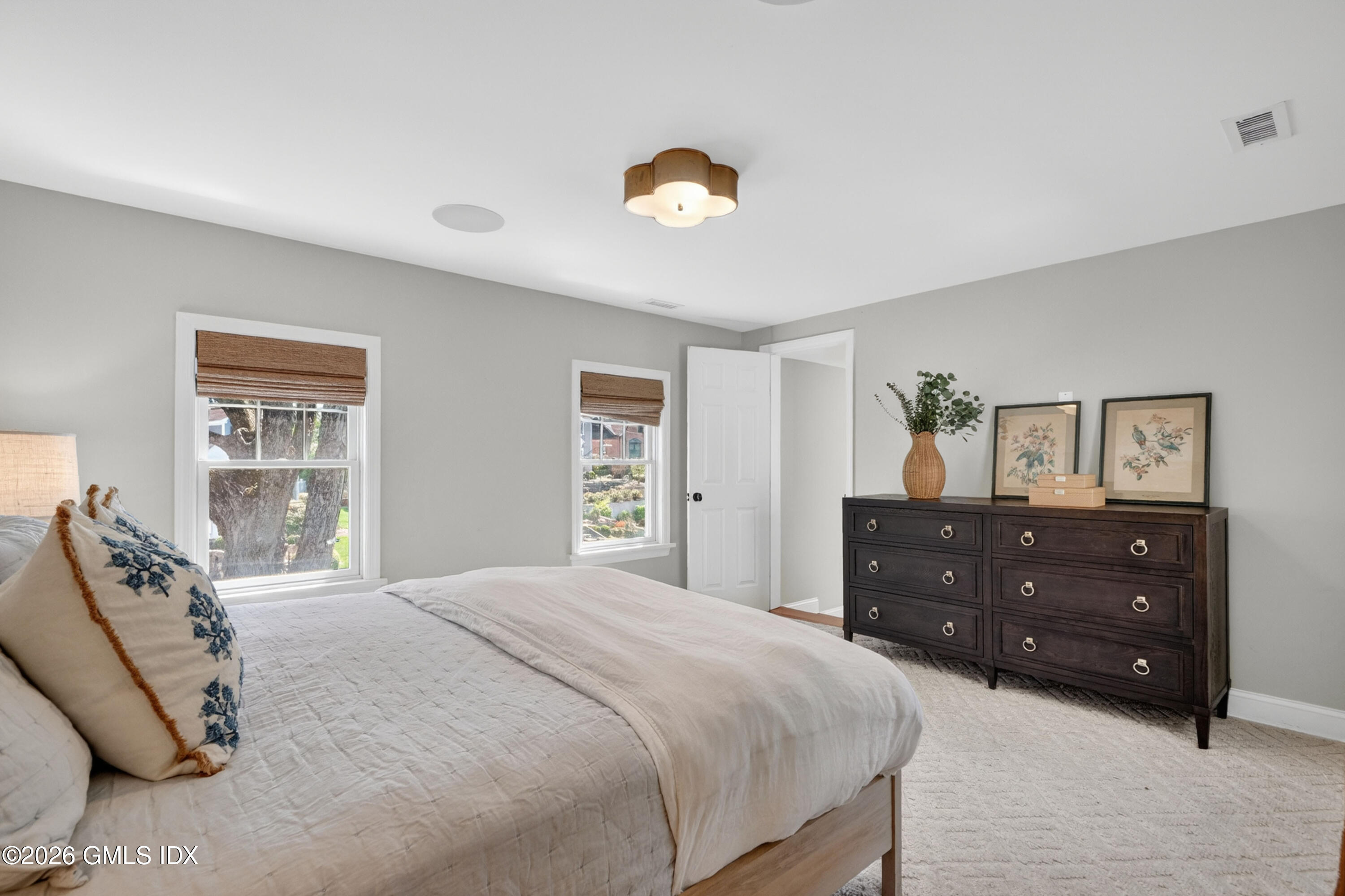 20 Ridge Road Cos Cob, CT 06807 - Photo 22 of 36 a bedroom with a bed and a window