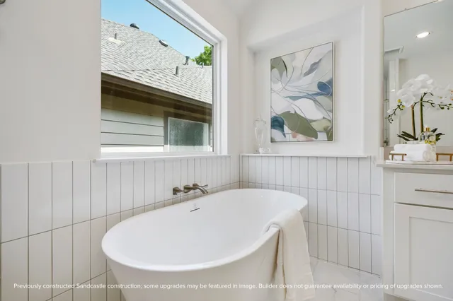 a bathroom with a tub and a sink