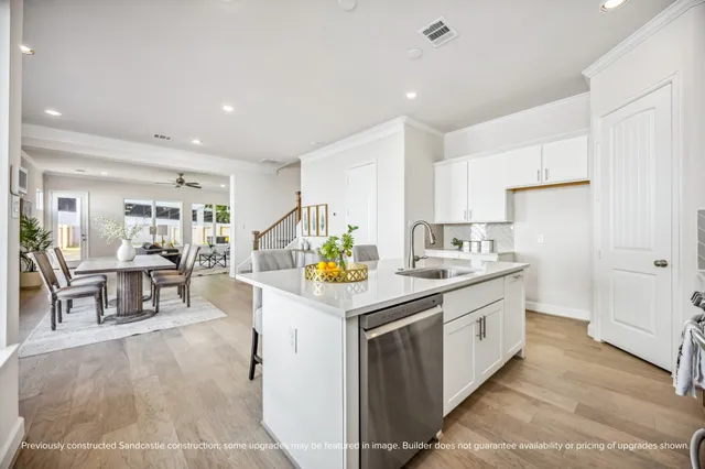 a kitchen that has a lot of cabinets in it and appliances