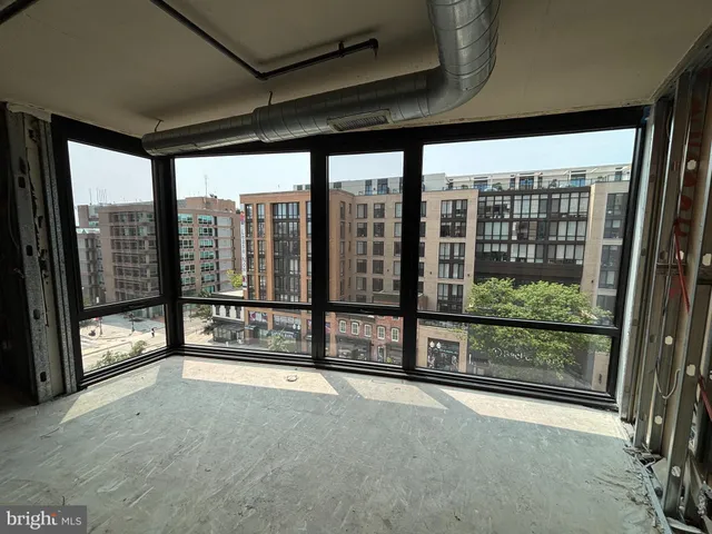 a view of an empty room with a balcony