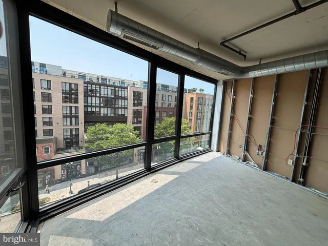 a view of an empty room with a balcony