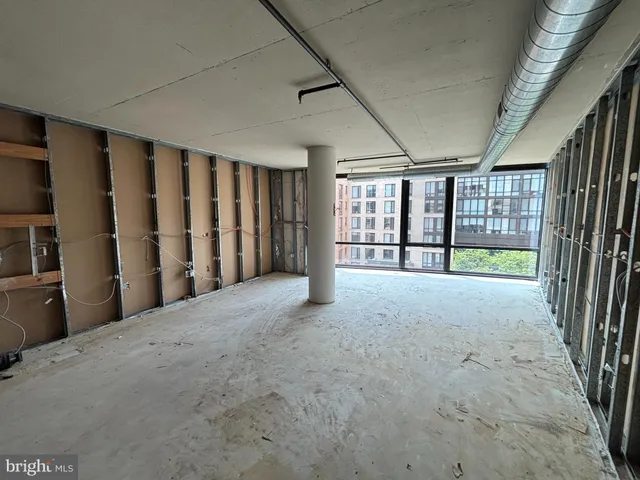 a view of an empty room with a balcony