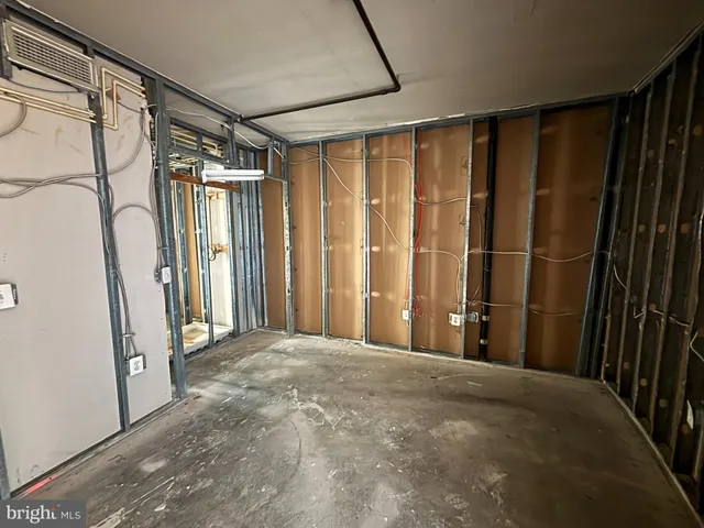 a view of a bathroom with a shower and a tub