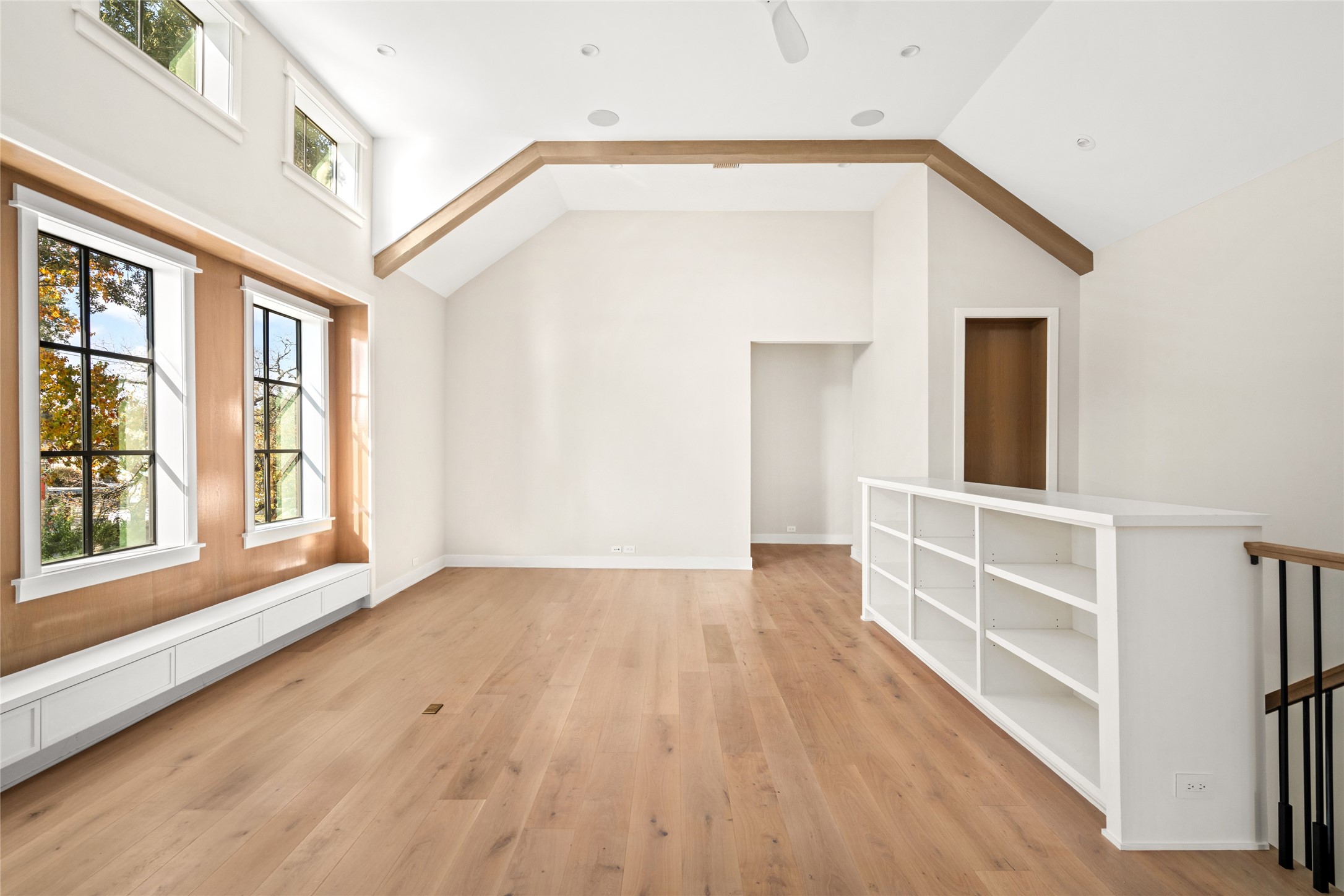 1136 Woodland Street Houston, TX 77009 - Photo 26 of 50 Custom window wall with built-in bench seating and treetop views brings warmth, natural light, and architectural interest to the upper level gameroom.